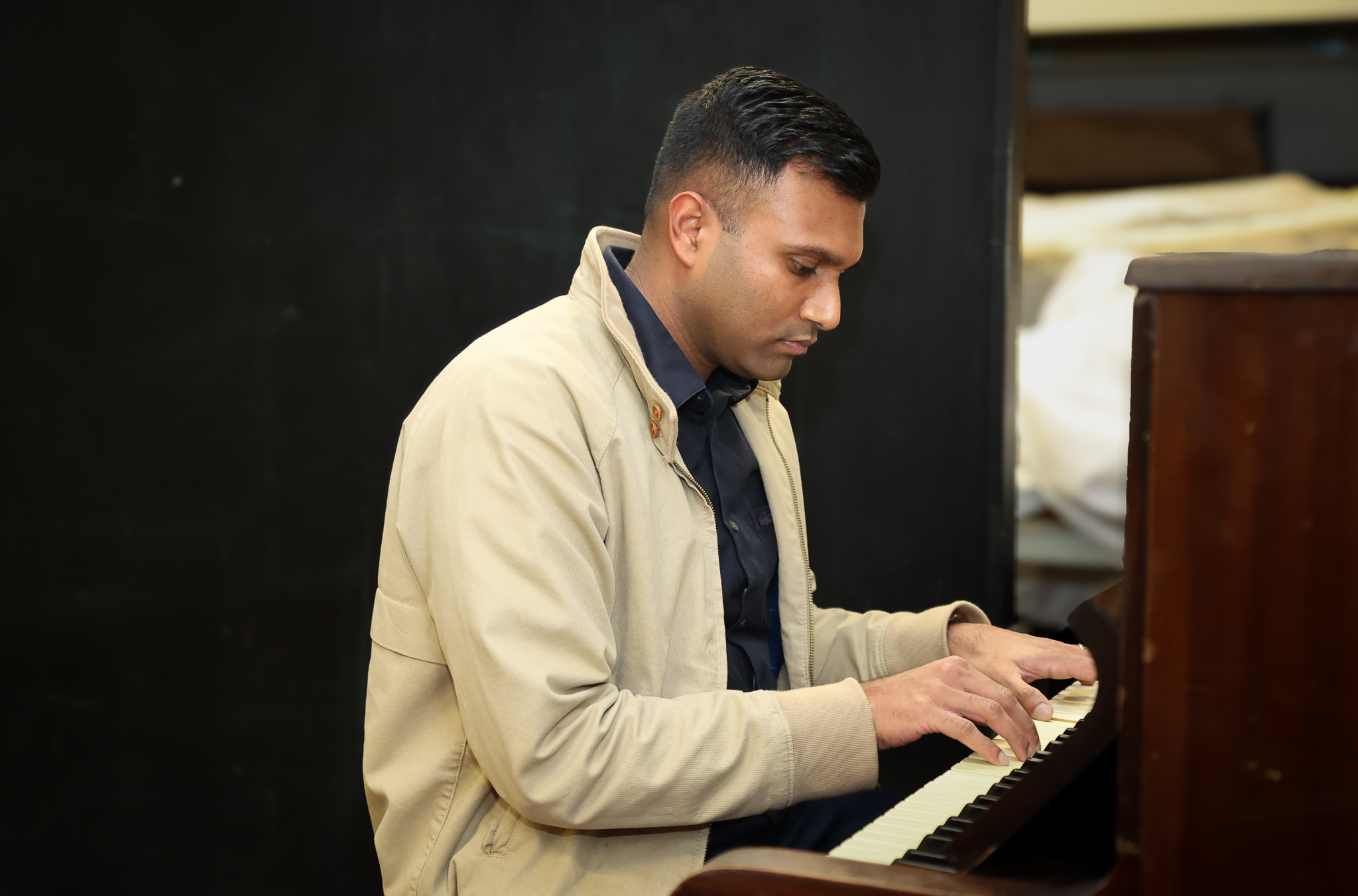 Pasan Thilakasiri opening Good CX Innovation Lab on the piano at Auckland Theatre company