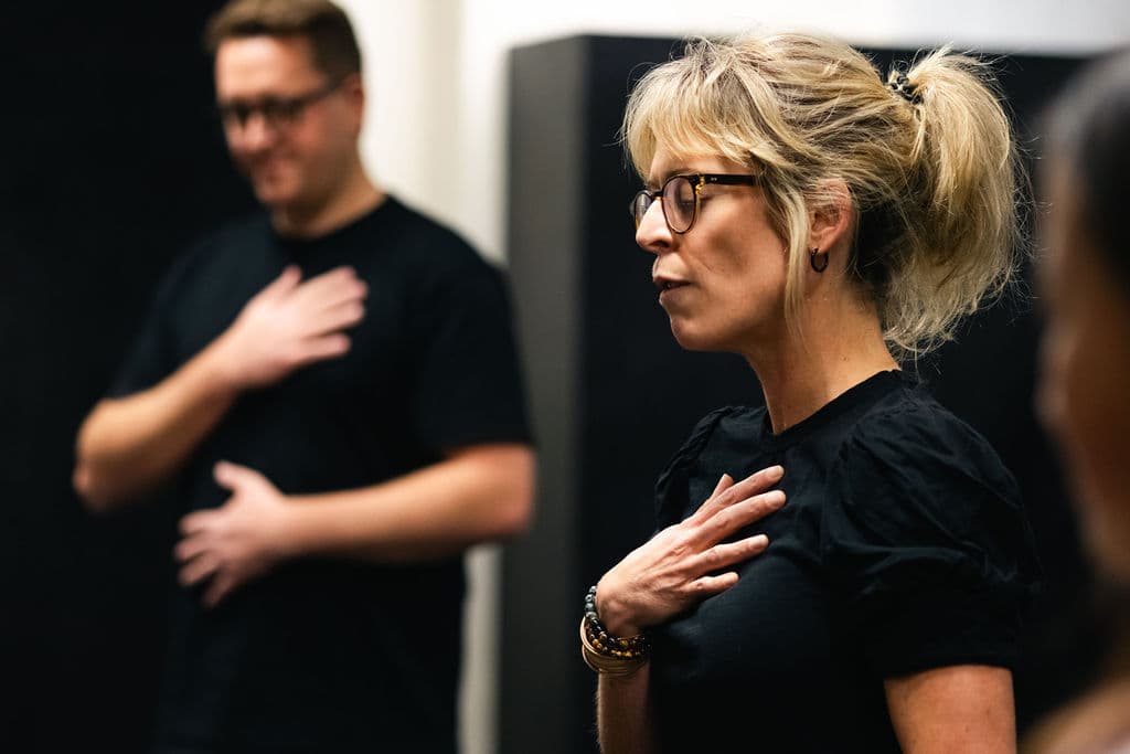 Ange Black leads the polyvagal-informed breath work warm-up at the Good CX Auckland Theatre Company innovation lab.