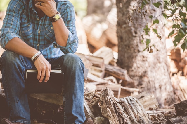 Founder sitting with a notepad, thinking through the work of building a saleable business