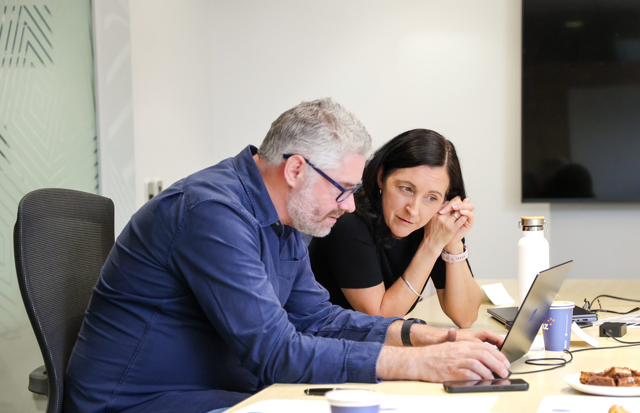 Craig Manning, measurement and modelling specialist, reviewing analytics with the Good CX team