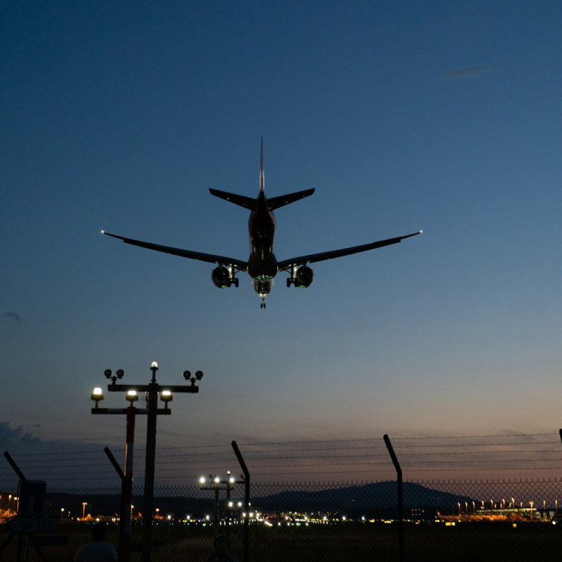 Aircraft taking off at dusk, representing global brand adaptation and reaching export markets